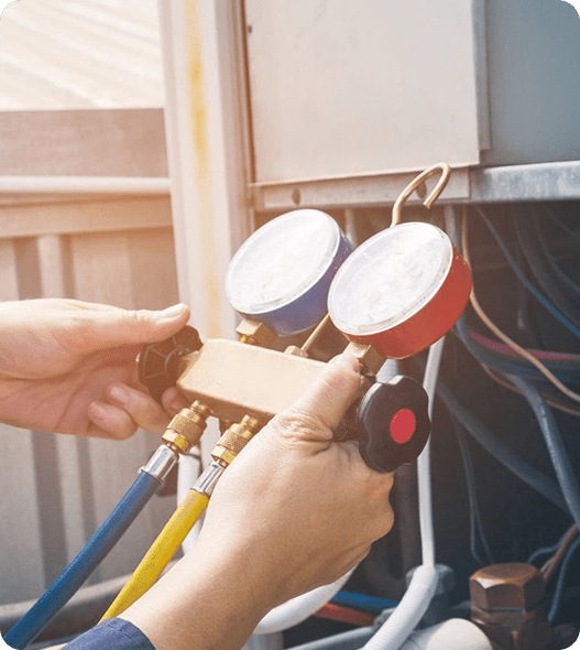 A person is adjusting the air conditioning unit.